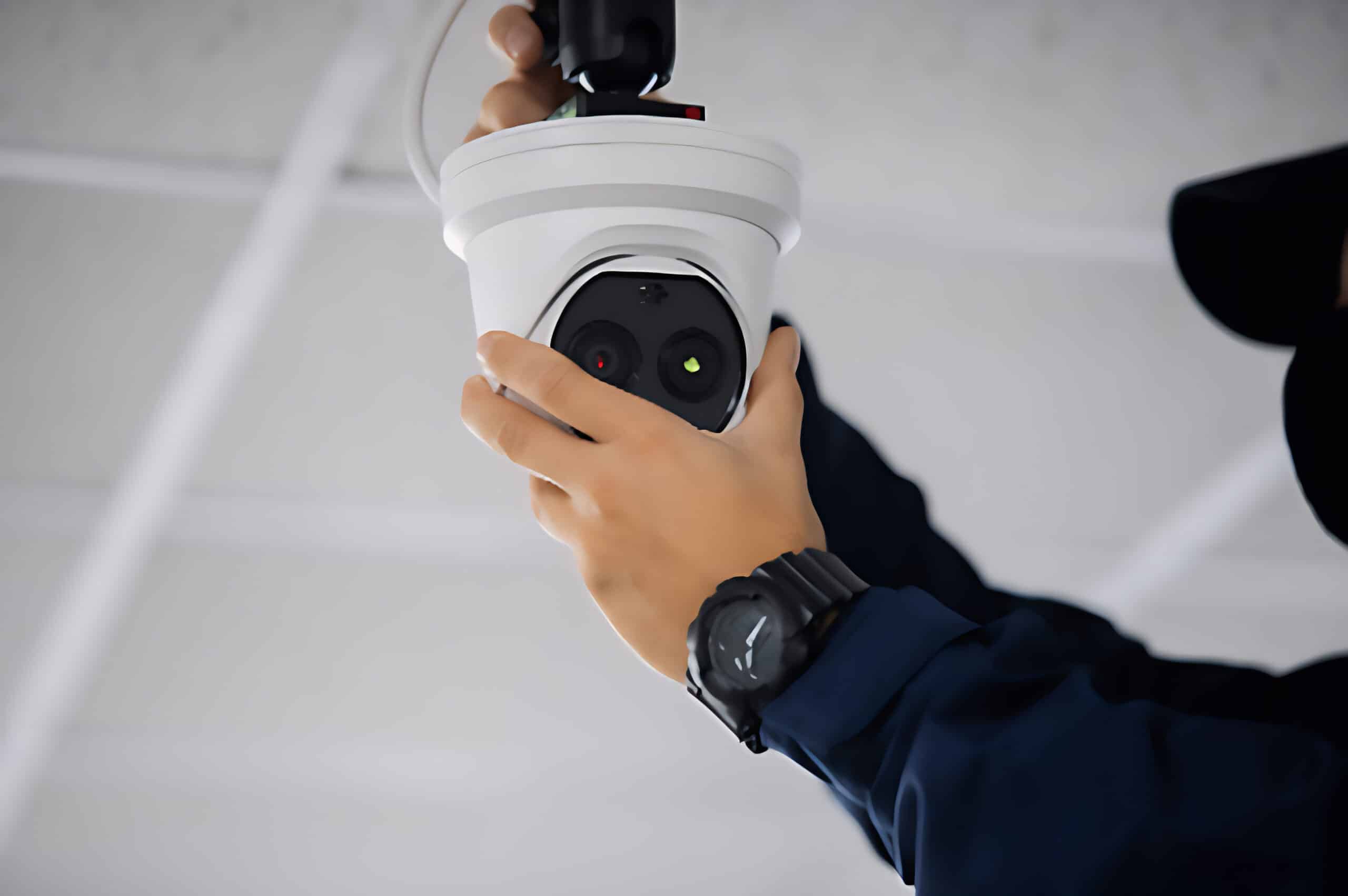 person installing security camera
