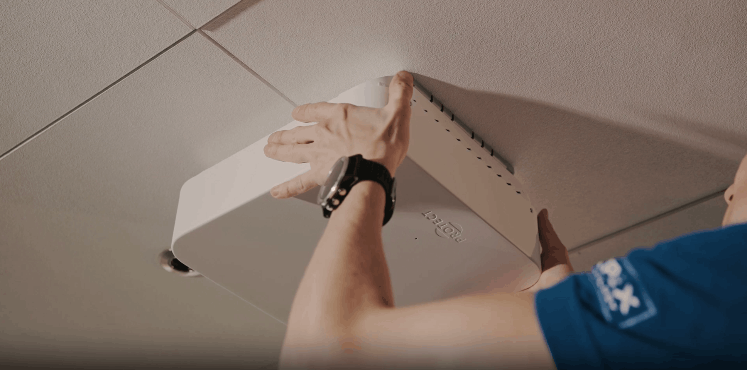 technician installing fog cannon