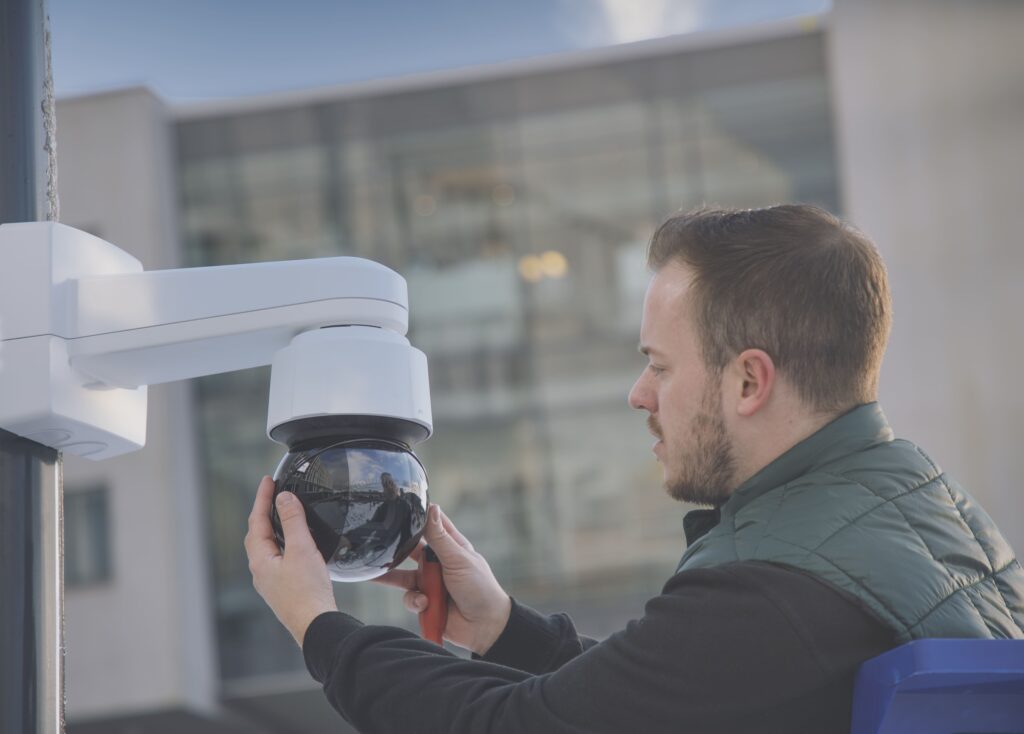 person installing security camera