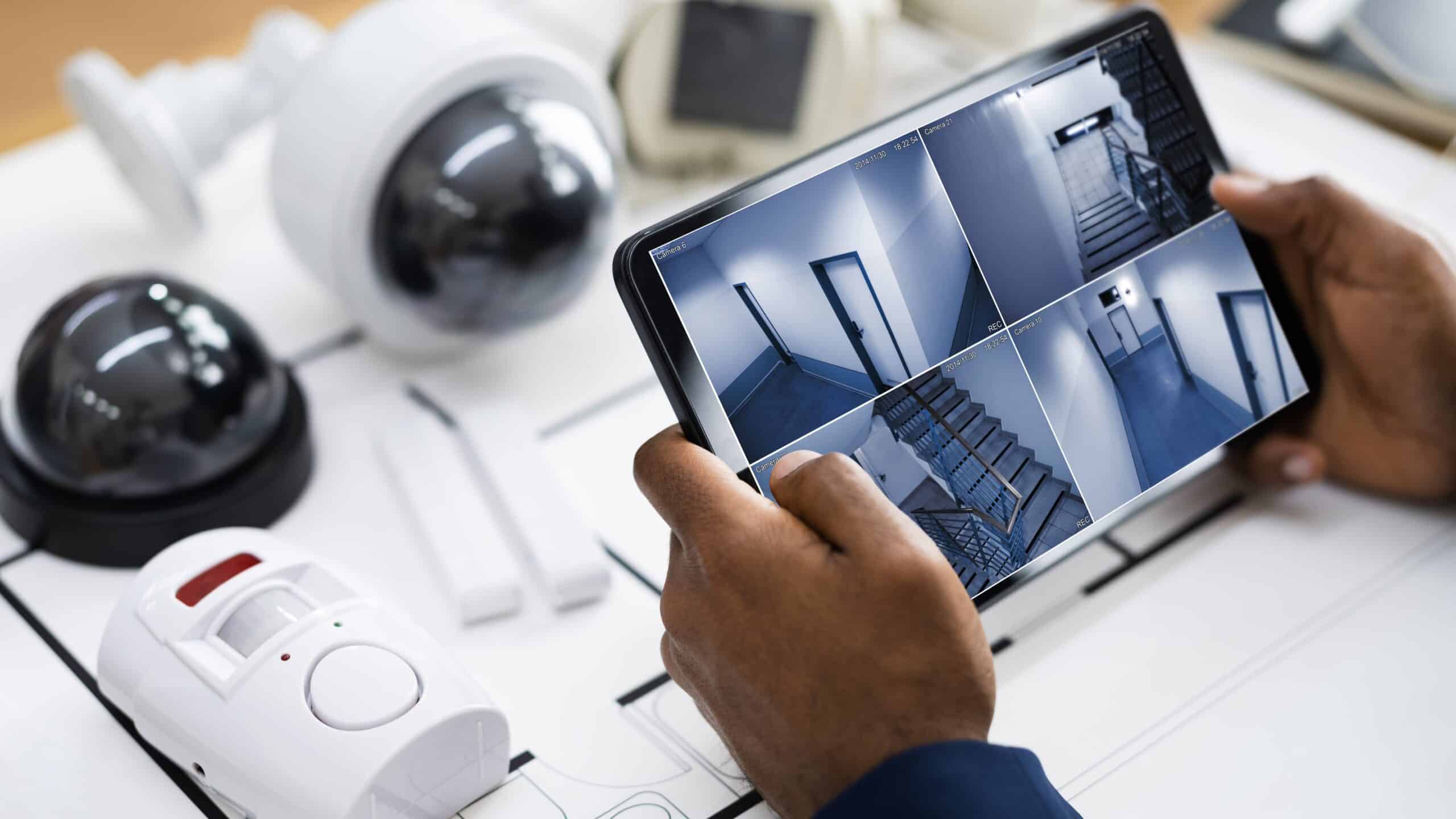tablet displaying security camera feeds